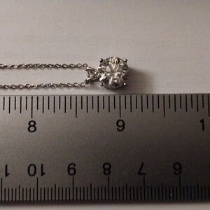 Sterling silver necklace w/ a 2ct mossinate stone.